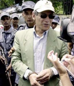 Look at how this man is dressed. Notice the bracelets on his wrists. He is a serial killer that killed unwitting couples he met in Europe and Asia.